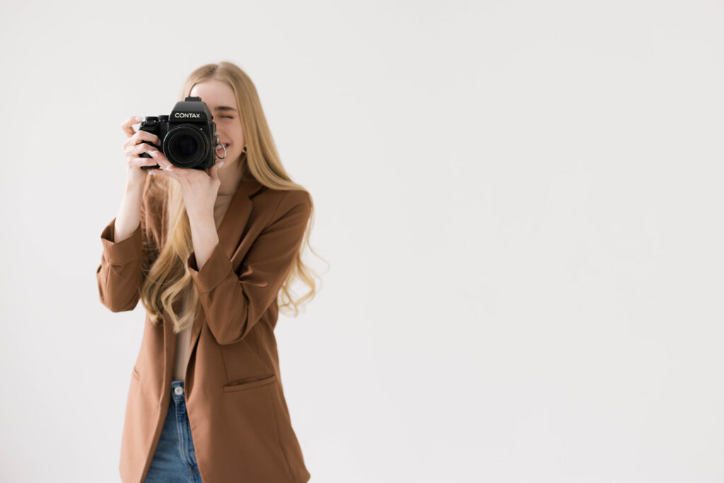 Kiley with Kiley Ann Photography posing fo r for a professional portrait for her wedding photography business based in Columbia, Missouri.