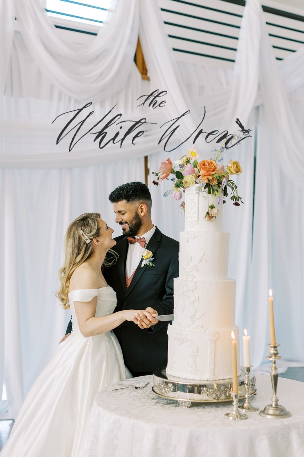 A couple standing in front of a Renaissance-inspired wedding celebration at Emerson Fields captured by Kiley Ann Photography. Published by the White Wren.