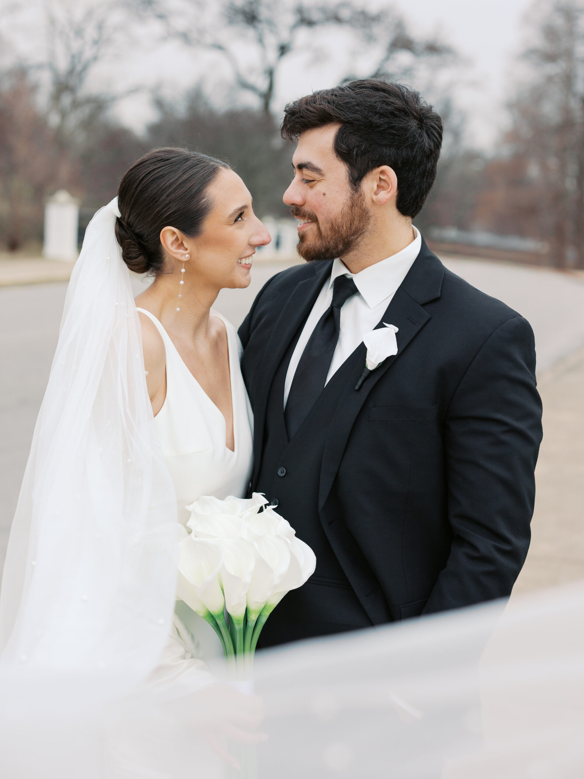 A January wedding at The Jewel Box and The Willow in St. Louis featuring black attire, personalized details, and joyful, timeless moments captured by a Saint Louis wedding photographer, Kiley Ann Photography.
